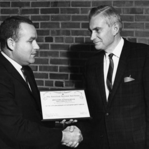 George Hyatt Accepting Certificate from American National Red Cross