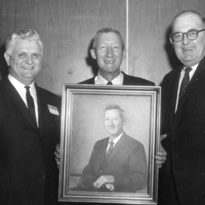 Three Men with Portrait