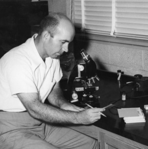Joseph N. Sasser at microscope
