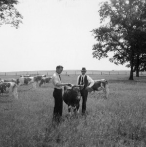 G.H. Cartner and R.H. Ruffner with heifer
