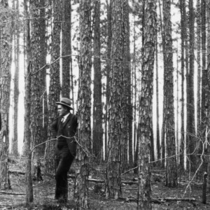 County Agent O. R. Carrithers and farmer W. M. Green in second growth longleaf pines