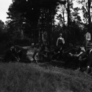 M. R. Sykes and neighbors at meeting in pasture