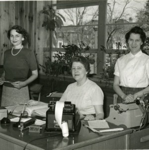 Three women at desk