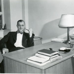 Professor George K. Slocum at desk