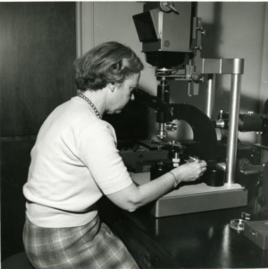 Woman using microscope in Forestry lab