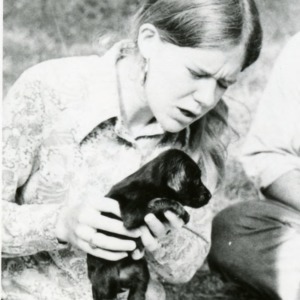 Student with puppy at forestry camp