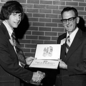 Frank W. Metheny accepting certificate