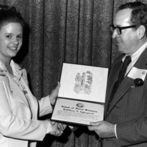 Kathleen T. Gylnquist accepting certificate