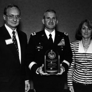 General Dan K. McNeill receiving Distinguished Alumnus Award with Dean Nielsen and Mrs. McNeill