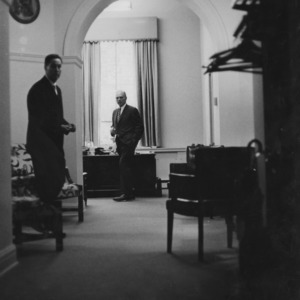 John T. Caldwell and other man in office