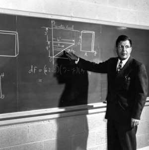 Dr. John W. Cell teaching at chalkboard