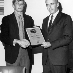 Dr. H. B. Craig and student with certificate