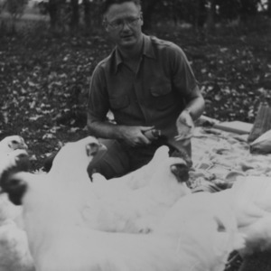 Gerald O. T. Erdahl with chickens
