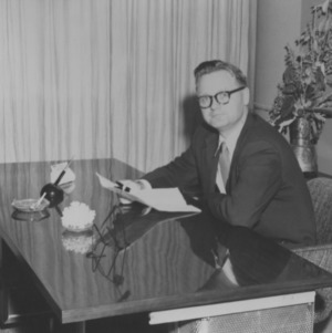 Gerald O. T. Erdahl at desk