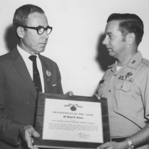 Dr. Ralph E. Fadum receiving Outstanding Civilian Service Medal from Army