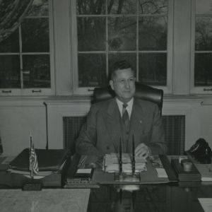 Chancellor John W. Harrelson at desk