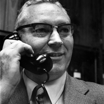 Dean James E. Legates on telephone