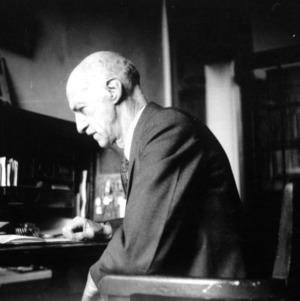 Dr. Thomas H. Nelson at desk