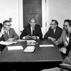 Harold F. Robinson and others in meeting