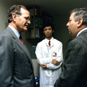 President George Bush with Zhi-Yu Yang and Jan Schetzina in Schetzina's lab