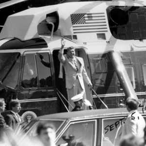 Ronald Reagan waving on Air Force One during visit