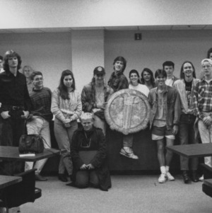 Group of students with NCSU school seal