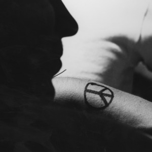 Peace symbol painted on arm