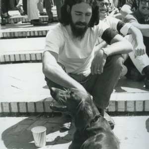 Man with dog at anti-war demonstration