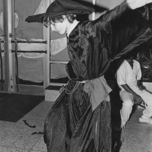 Student in witch costume at Halloween dance