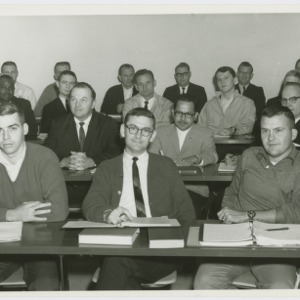 Male students sitting in class