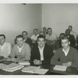Male students sitting in a classroom