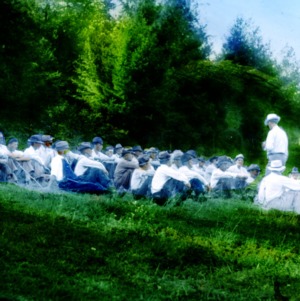 Group of men at a class in a field