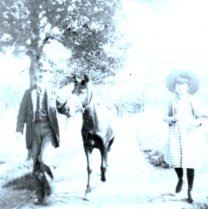 Two people and a horse