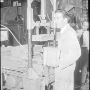 Man with hydraulic block machine "George"
