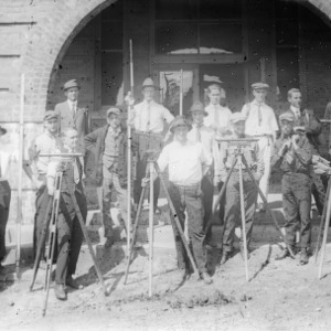 Group of men with survey equipment