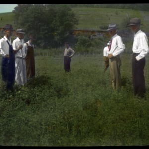 Men standing in a field