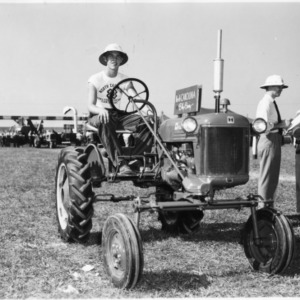 Boy riding tractor