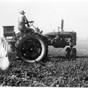 Tractor with sprayer attached