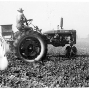 Tractor with sprayer attachment