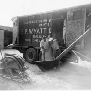Unloading grain from Job. P Wayatt and Sons Co. truck