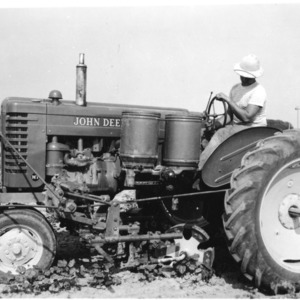 John Deere tractor and cultivator with "Maco" cotton chopper