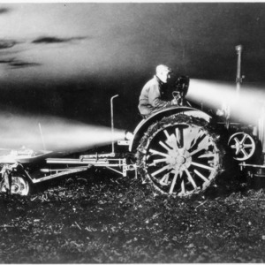 Early example of tractor equipped with electric lights