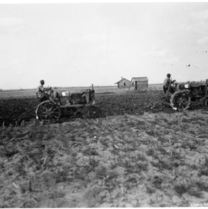 Tractors Pulling Soil Preparation Equipment