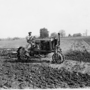 Farmall Tractor with Disc in Field
