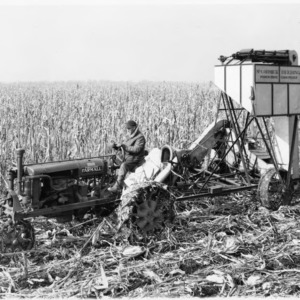 McCormick-Deering One-Row Corn Picker Powered by McCormick-Deering Farmall Tractor