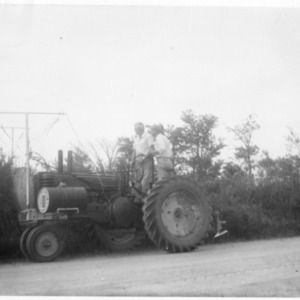Two men on tractor