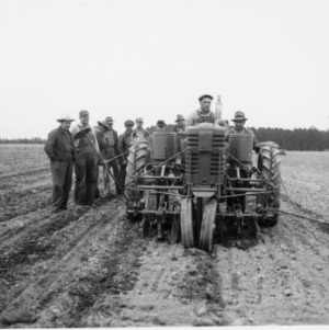 Men with two-row planter