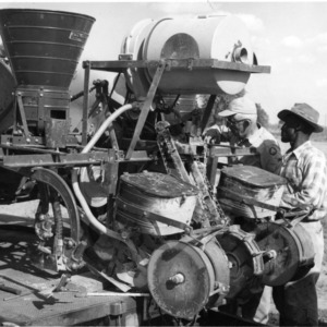 Men with agricultural machinery