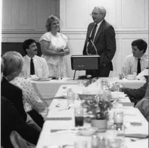 Man and woman speaking at dinner