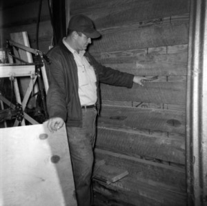 Man in grain drying storage